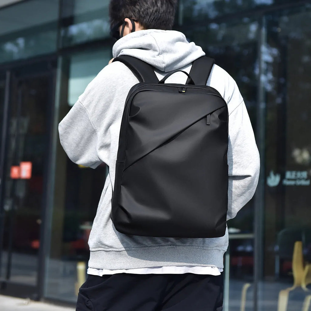 Large black waterproof backpack with 40 litre capacity and PU leather construction