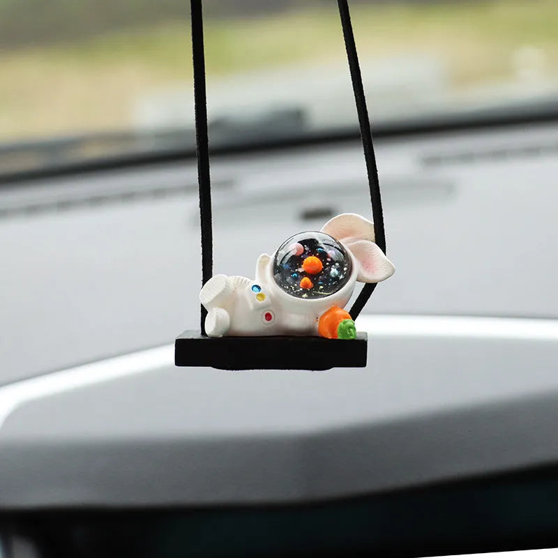 Cartoon astronaut resin pendant for car decoration, shown in various colour and style options.