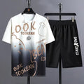 Men's light grey summer suit comprising a short sleeve t-shirt and matching shorts on a hanger