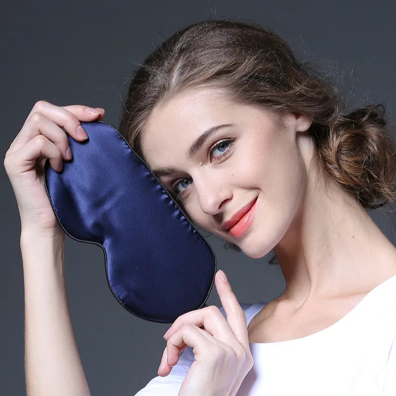 Double-sided mulberry silk eye mask in champagne colour with embroidered print.