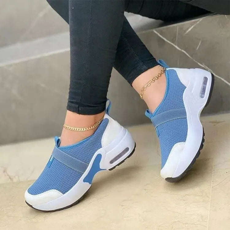 Women's white mesh sneakers with rubber soles and colour stitching details