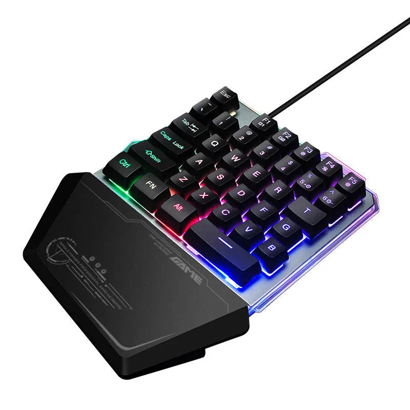 Black robotic one-handed gaming keyboard with RGB backlighting and USB cable