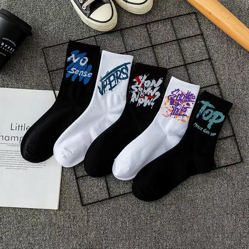 10 pairs of white cotton tube socks with graffiti pattern, middle calf length, on a plain background