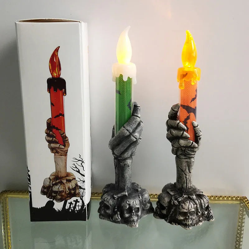 Plastic skeleton ghost holding a candle light Halloween decoration in orange and green