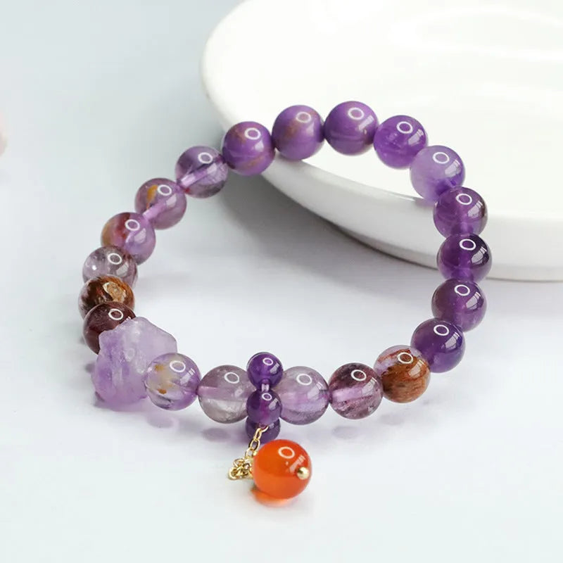 Natural nine purple amethyst bracelet with red agate accents showing 8mm beads