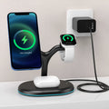 Black minimalist three-in-one magnetic wireless fast charging pad on a wooden desk.