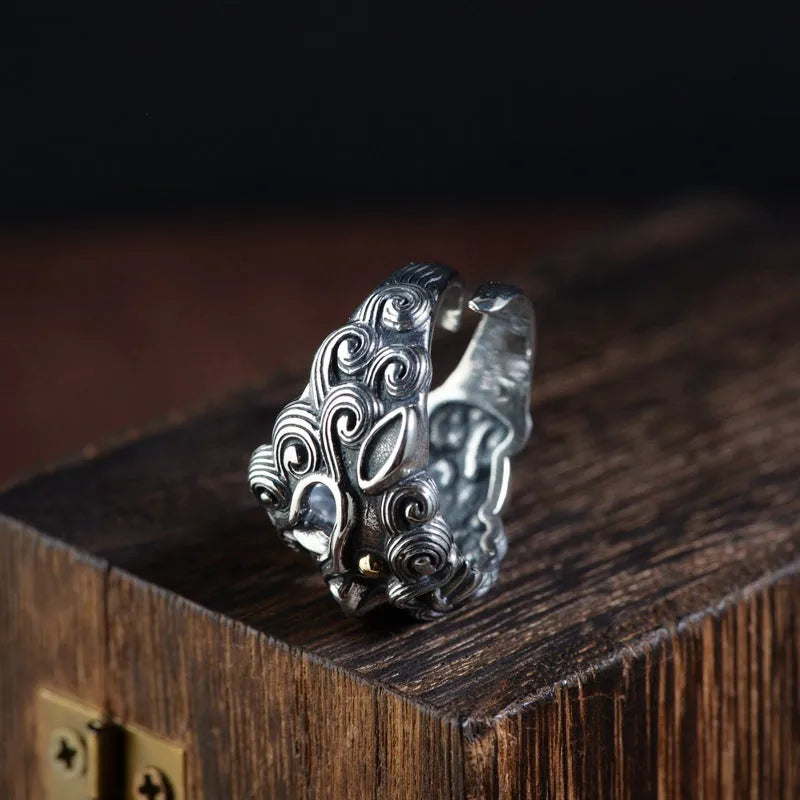 Personalised Jibeast pattern open style silver diamond ring on a hand.