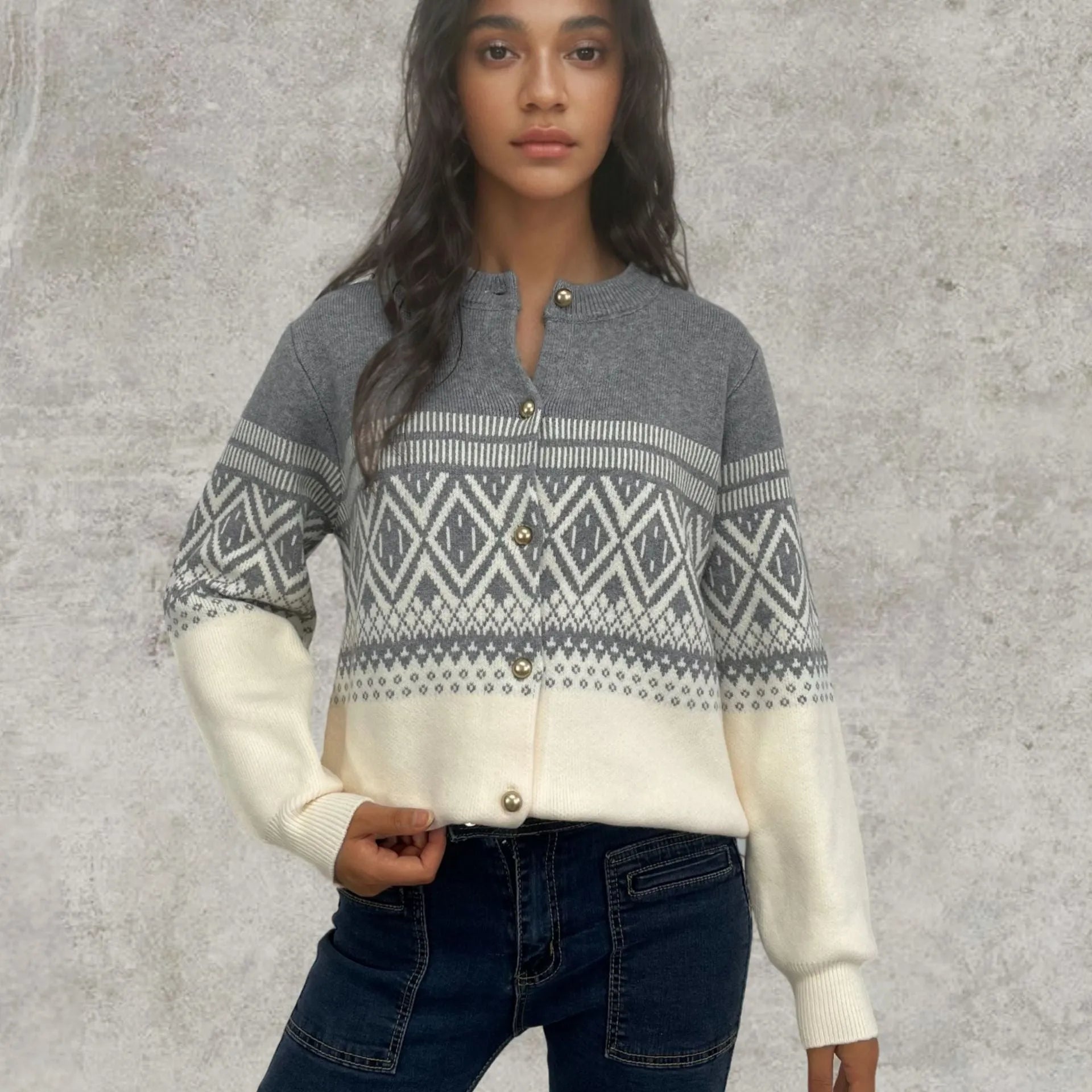 Women's long-sleeved grey alpaca wool cardigan with contrasting diamond knit pattern.