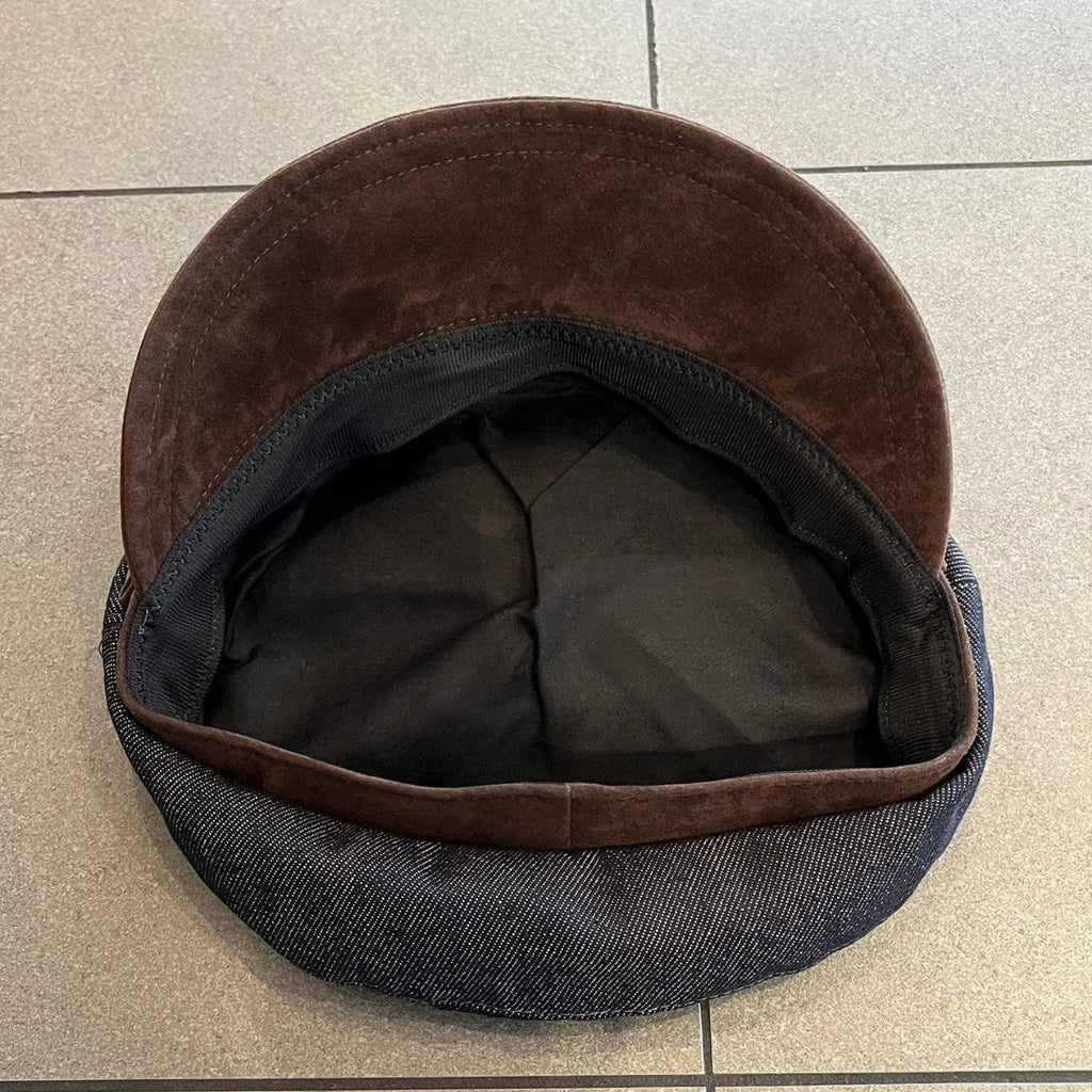 Dark blue denim octagonal newsboy hat with adjustable band and colour trim brim options
