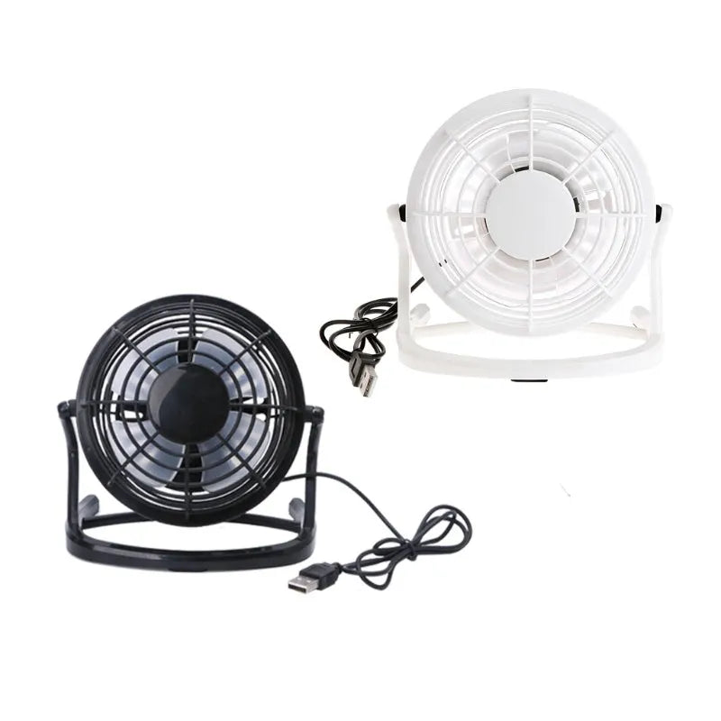 Black mini USB desktop fan with adjustable angle on wooden desk
