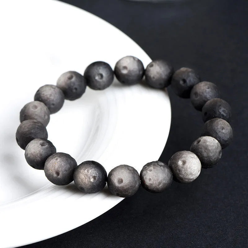 Natural obsidian crater ball bracelet with meteorite texture in silver or gold finish