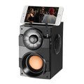 Black portable mini audio system with subwoofer, USB power cable and 3.5mm audio connection
