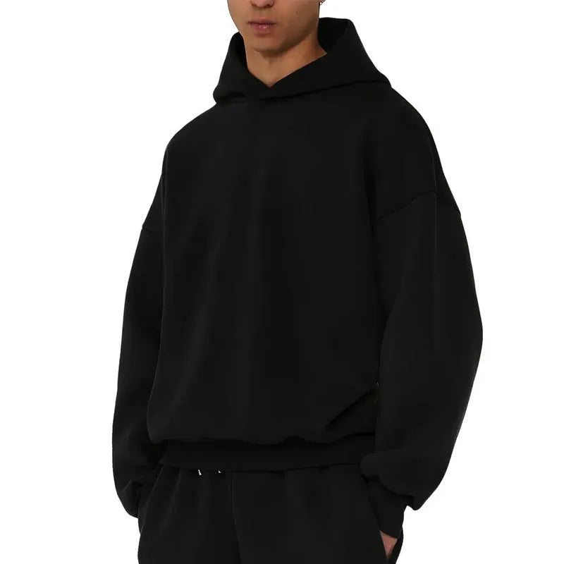 Men's grey fleece-lined pullover hoodie with wool lining shown in casual wear