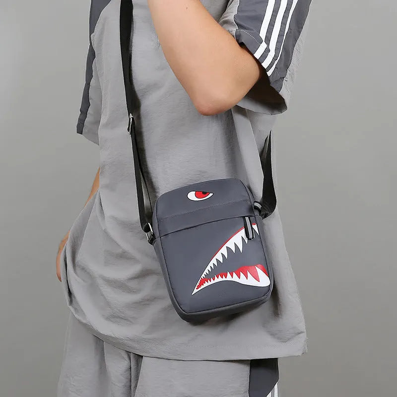 Men's black Oxford cloth crossbody bag with animal pattern design and shoulder strap