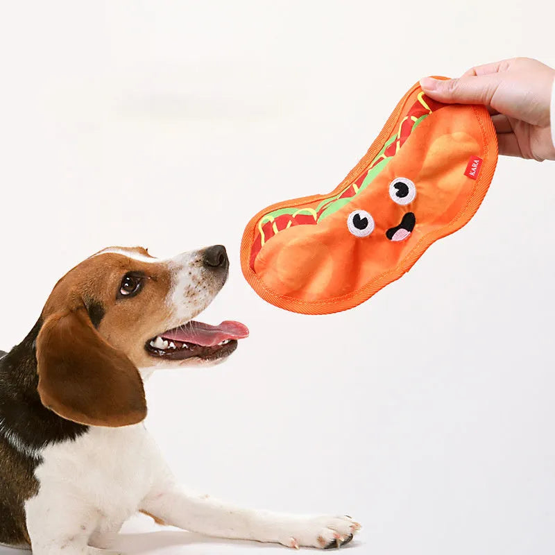 Food-themed dog chew toy in a hamburger design with red, yellow, and green colours, showcasing its no-stuffing construction.