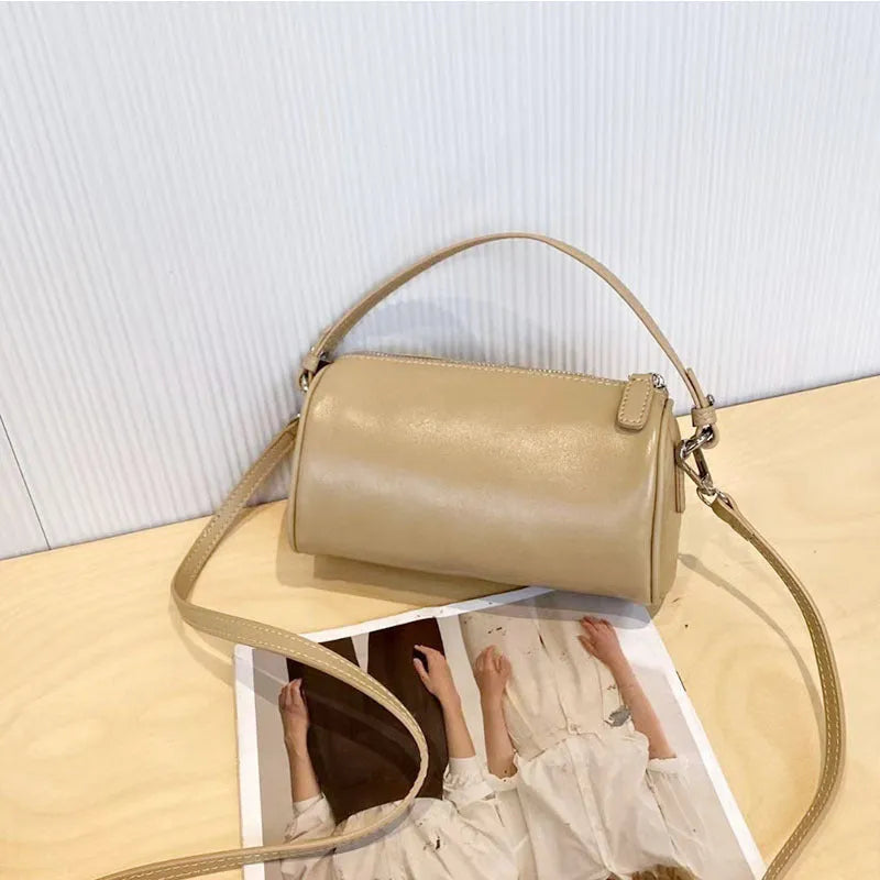 Genuine leather cylindrical crossbody phone bag in vegetable-tanned leather with single shoulder strap