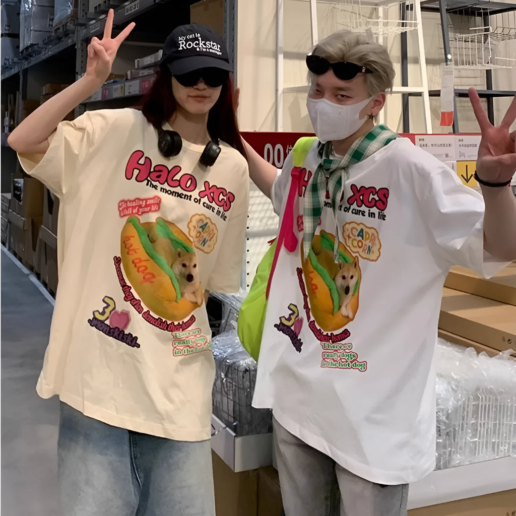 Cartoon hamburger dog printed loose-fit cotton t-shirt in apricot on a model.