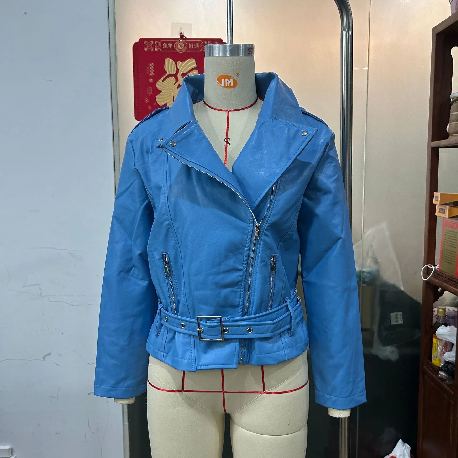 A black punk-style short jacket with a Peter Pan collar and a drawstring waist.