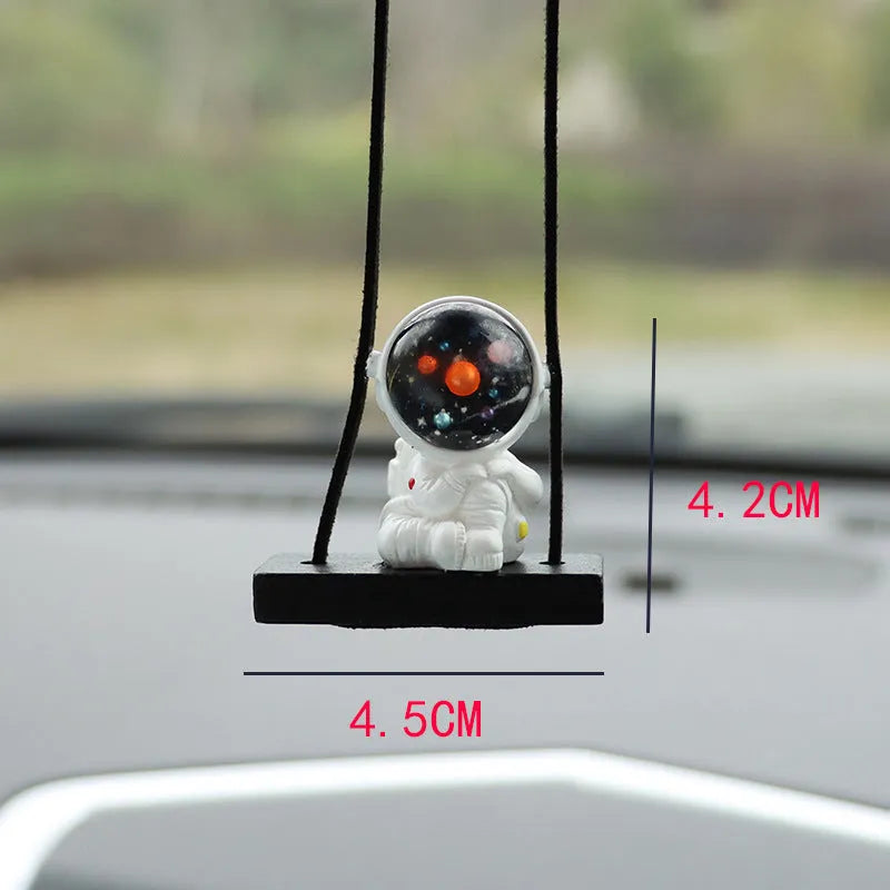 Cartoon astronaut resin pendant for car decoration, shown in various colour and style options.