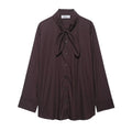 Brown women's poplin shirt with long sleeves, a bow tie, and a loose cardigan fit.