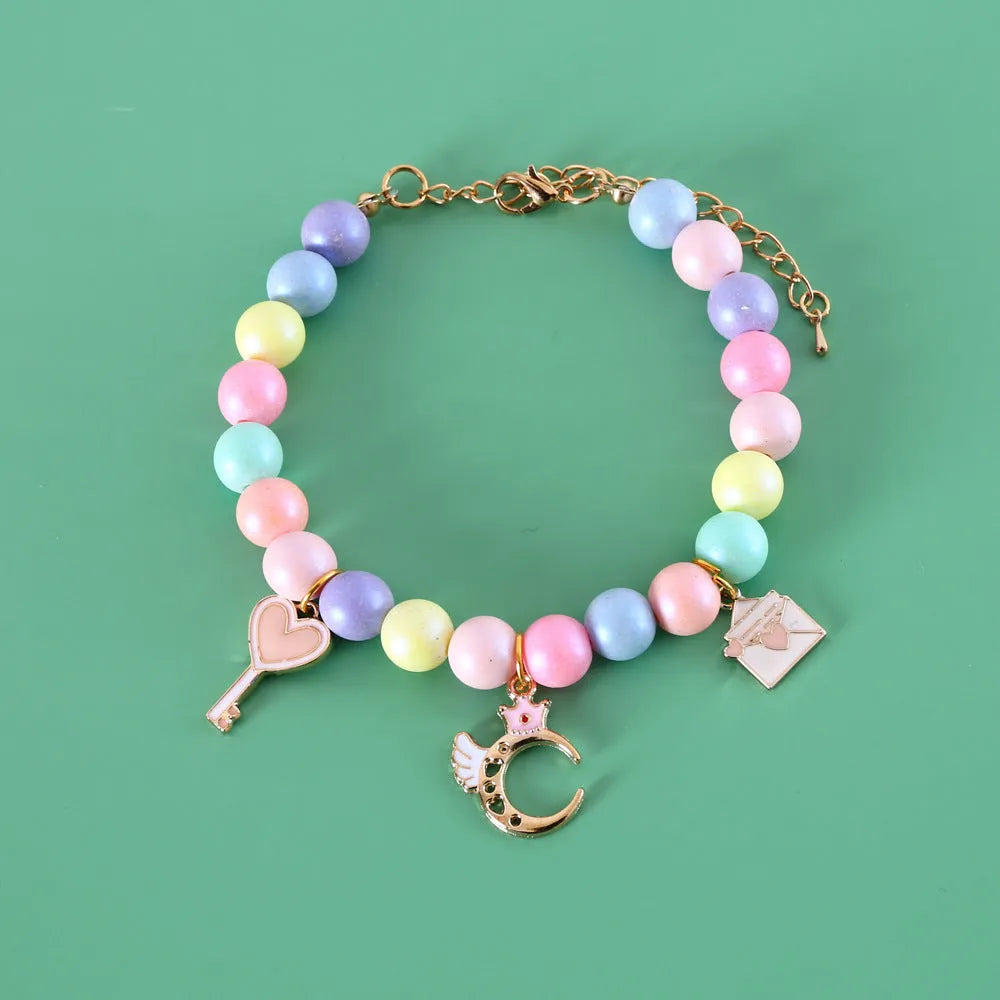Macaron-themed pet collar accessories in resin with adjustable sizing options