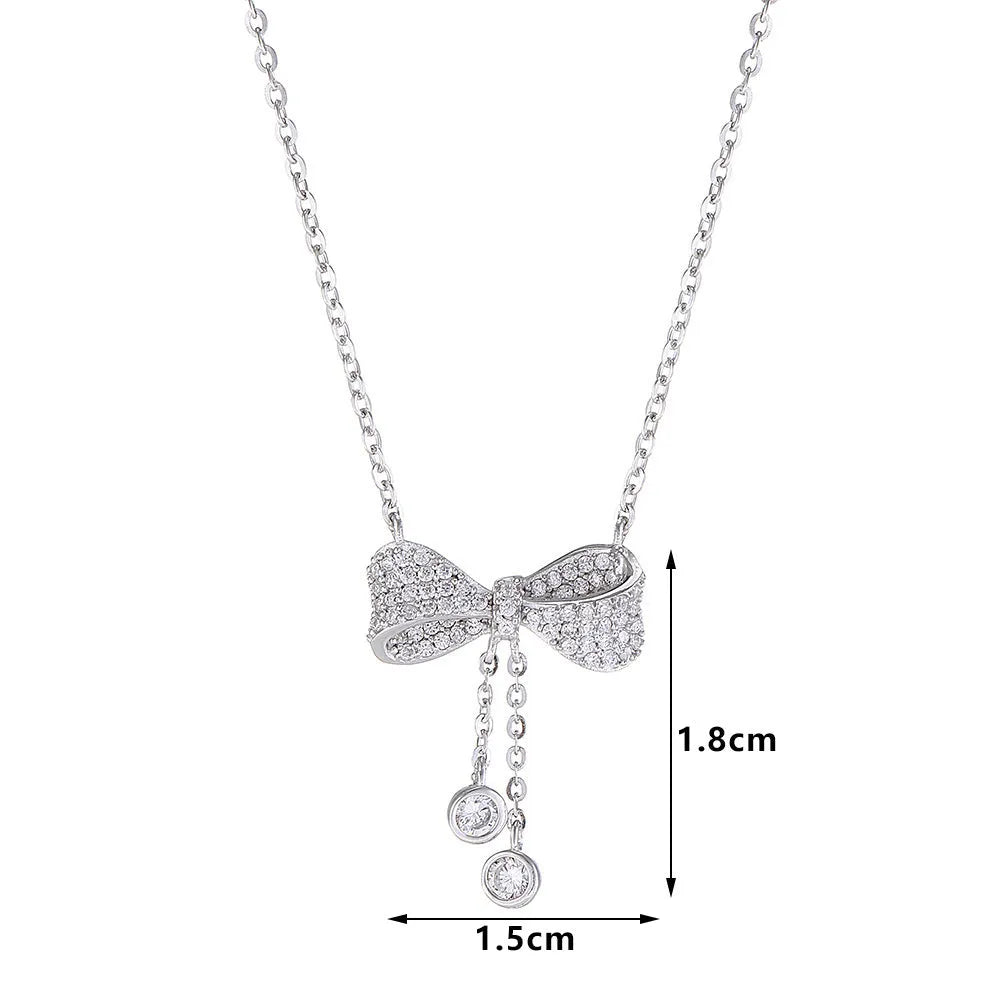 Silver bow pendant necklace on adjustable 40-45cm chain with O-ring closure