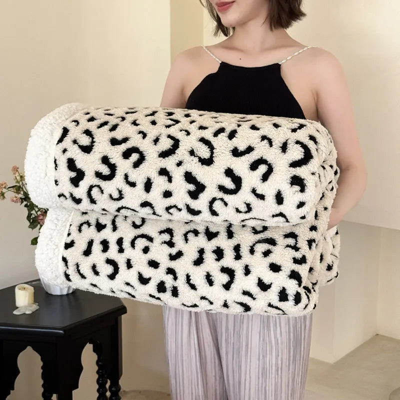 Double-layer cationic leopard jacquard taffeta blanket showing animal print pattern detail