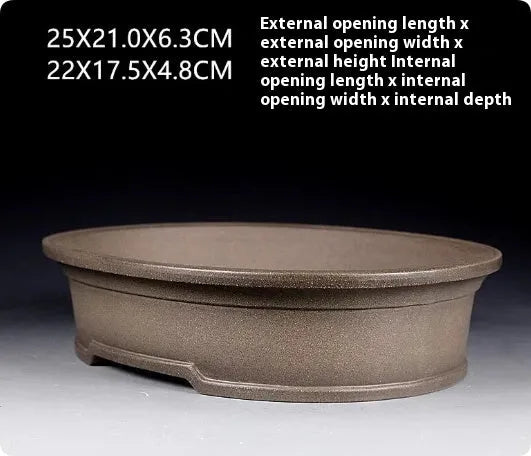 Handmade antique oval purple sand bonsai pot with dimensions 25x21x6.3 cm.