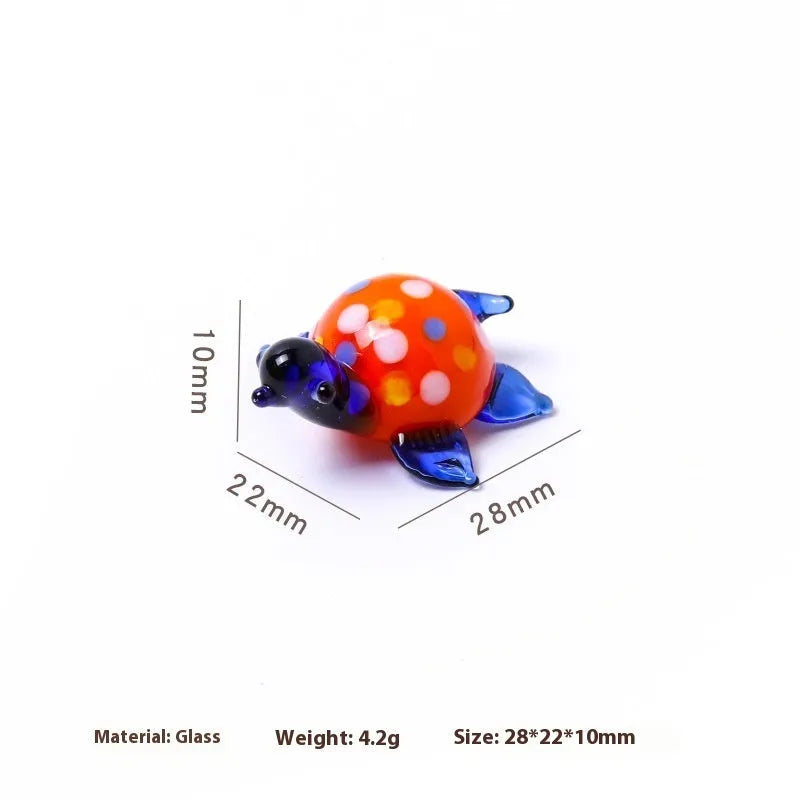 Glass turtle ornament with geometric modern design in six colour variations for desktop decoration
