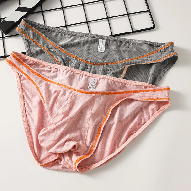 Men's dark grey modal hip-lift underwear with knitted ice silk fabric on a mannequin.