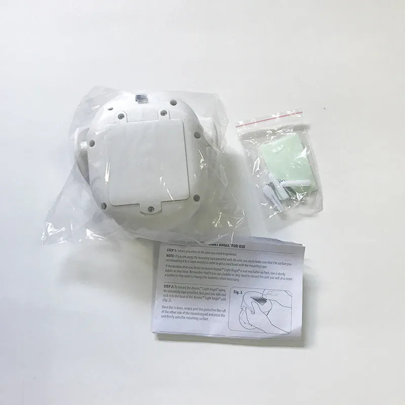 White Atomic Angel induction lamp with ABS plastic housing on a plain background.