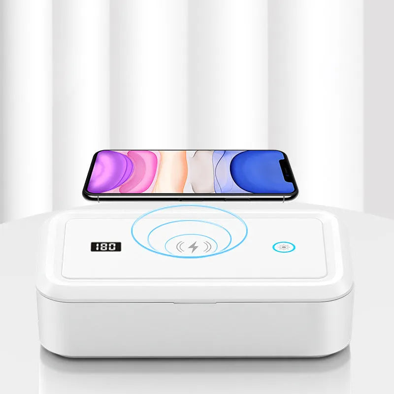 White cell phone disinfection box with USB cable, mechanical timer dial, and slot for smartphone insertion