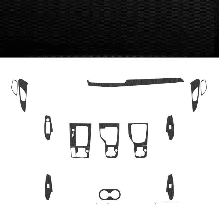 Car interior decorative film sticker kit showing carbon fibre pattern applied to centre console and dashboard