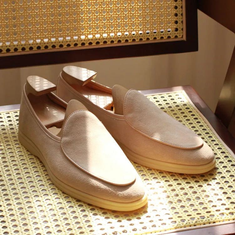 British handmade brown leather loafers for men on a white background
