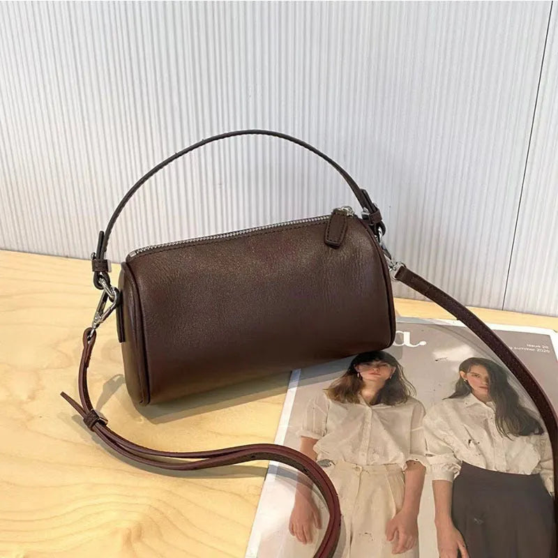 Genuine leather cylindrical crossbody phone bag in vegetable-tanned leather with single shoulder strap