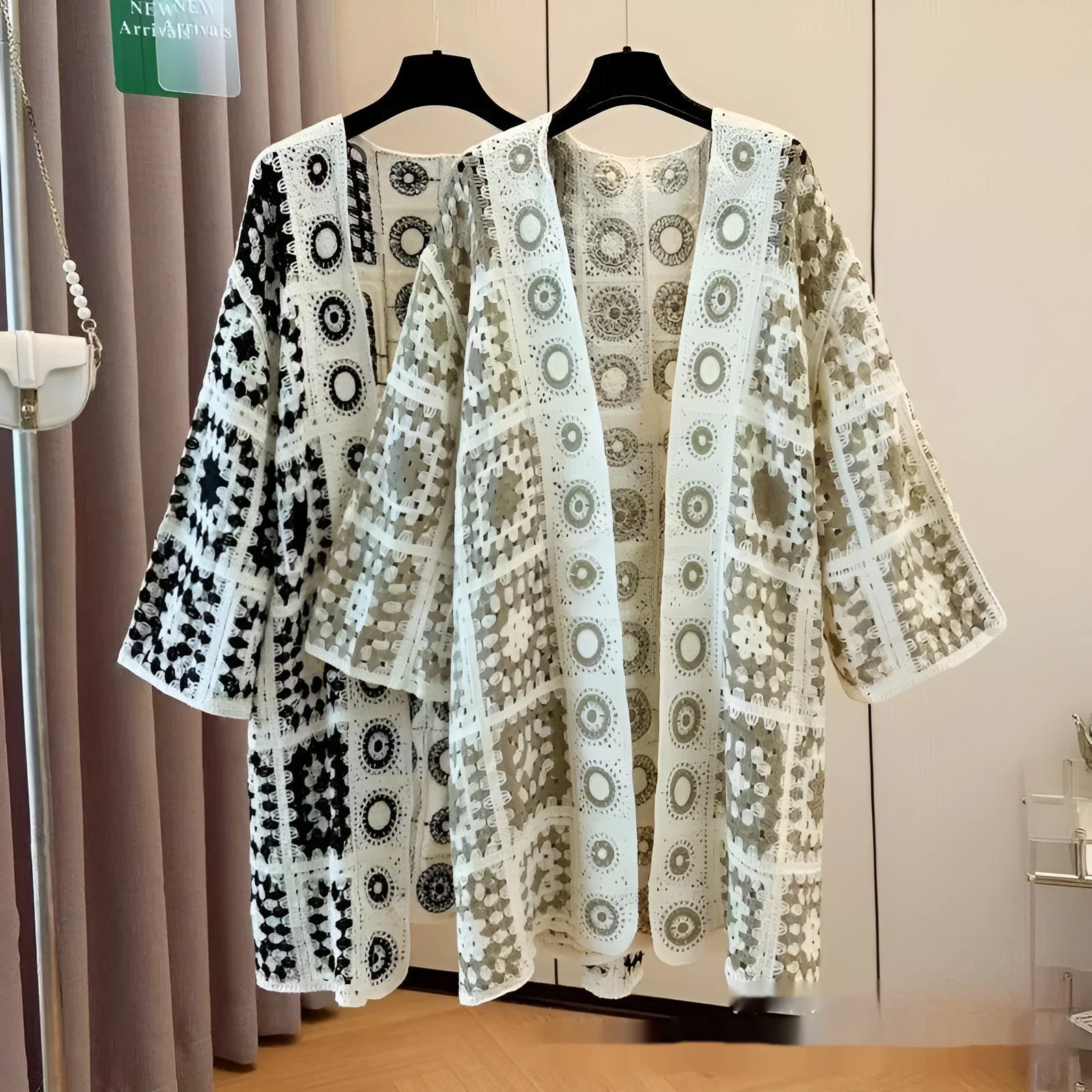 Ladies' loose embroidered thin knit cardigan in brown, front view on model