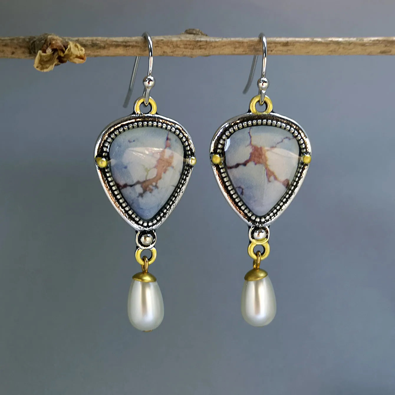 Retro blue Bohemian style drop earrings with geometric metal design, synthetic blue opal and white pearl elements