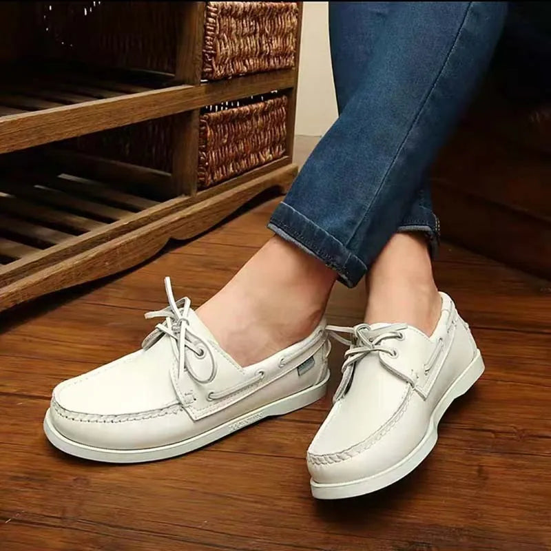 Men's black casual shoes with round toe, flat heel, and lace-up design on a white background.