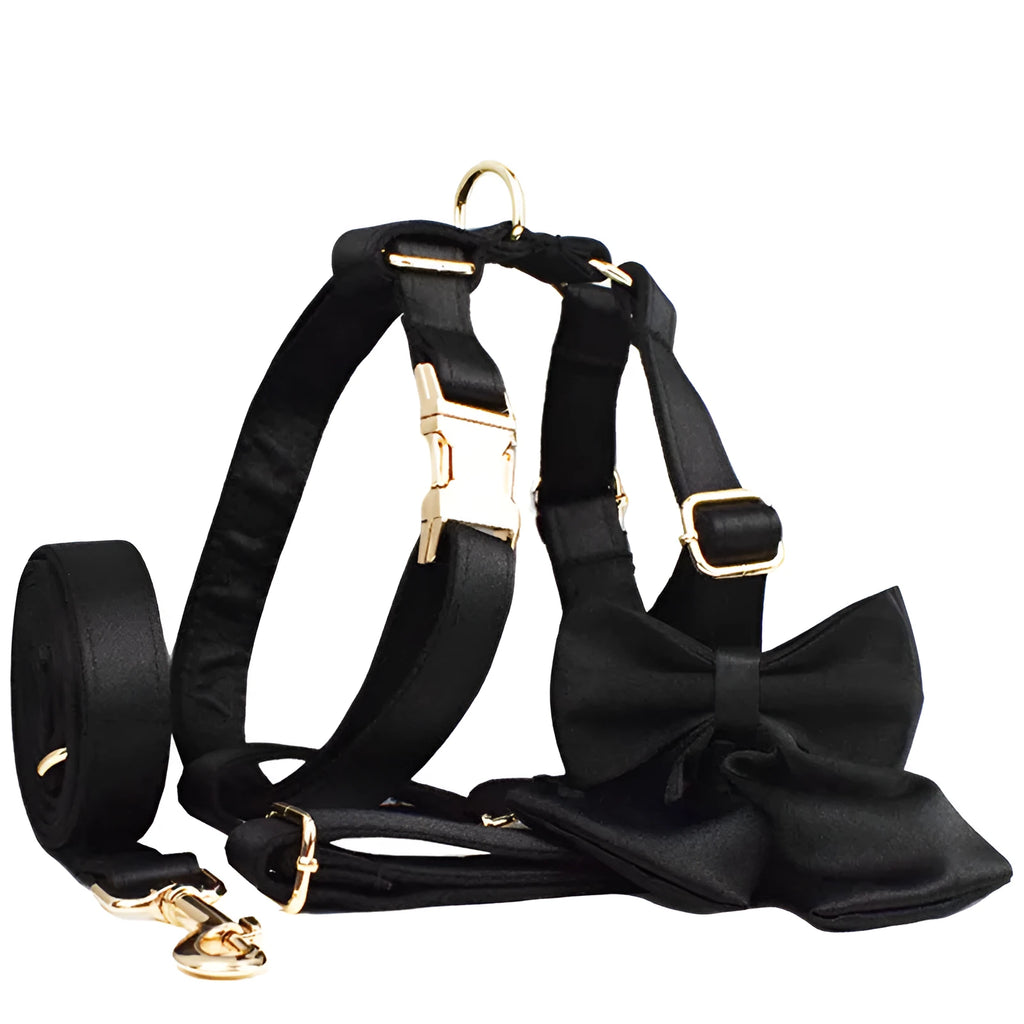 Cloth dog collar and leash set with matching harness vest and decorative bow in assorted colours.