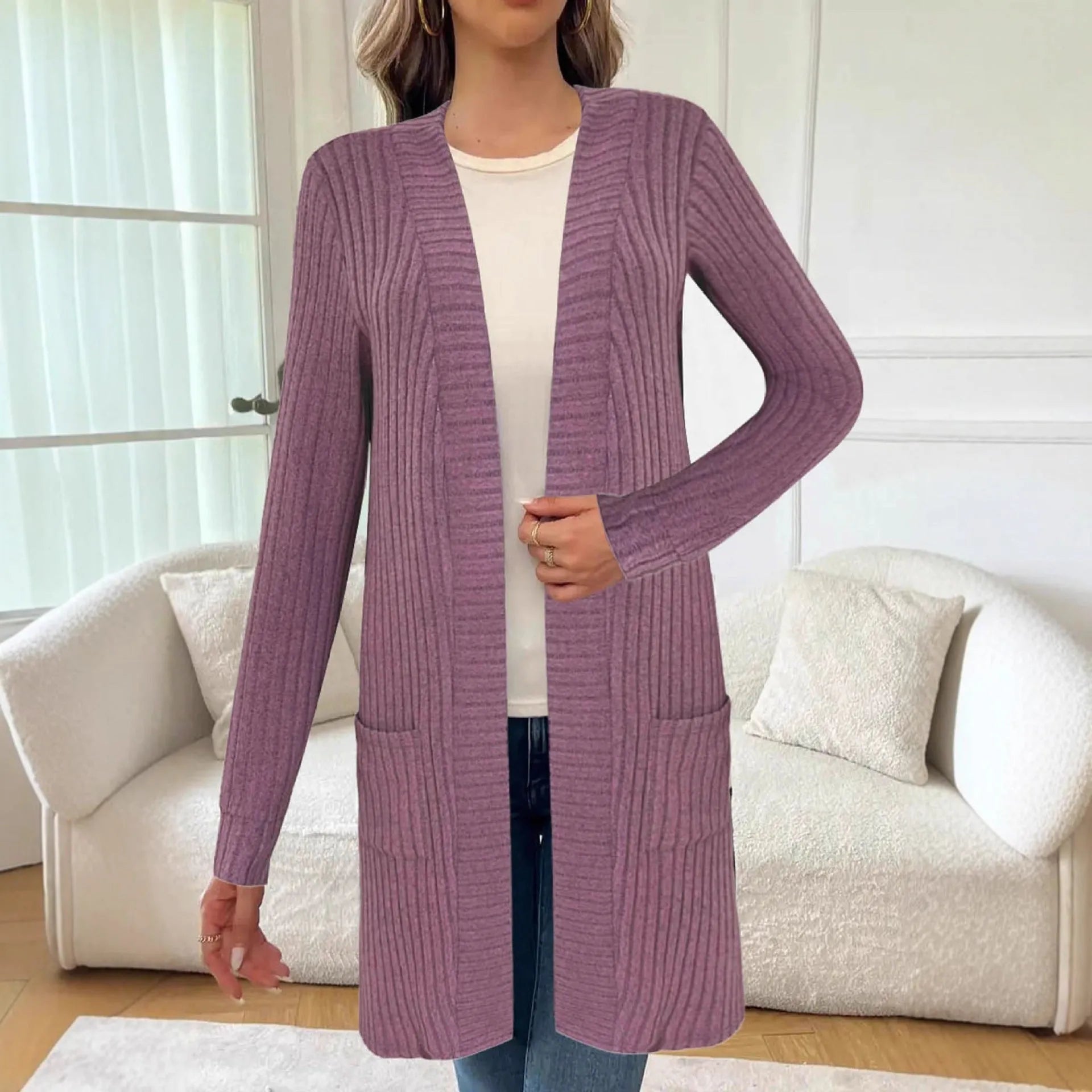 Loose long sleeve knitted cardigan jacket in black with side pockets.