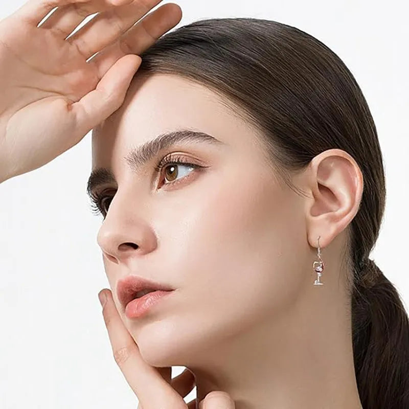Geometric zinc alloy dangle earrings featuring a detailed Halloween skull charm with an electroplated metallic finish.