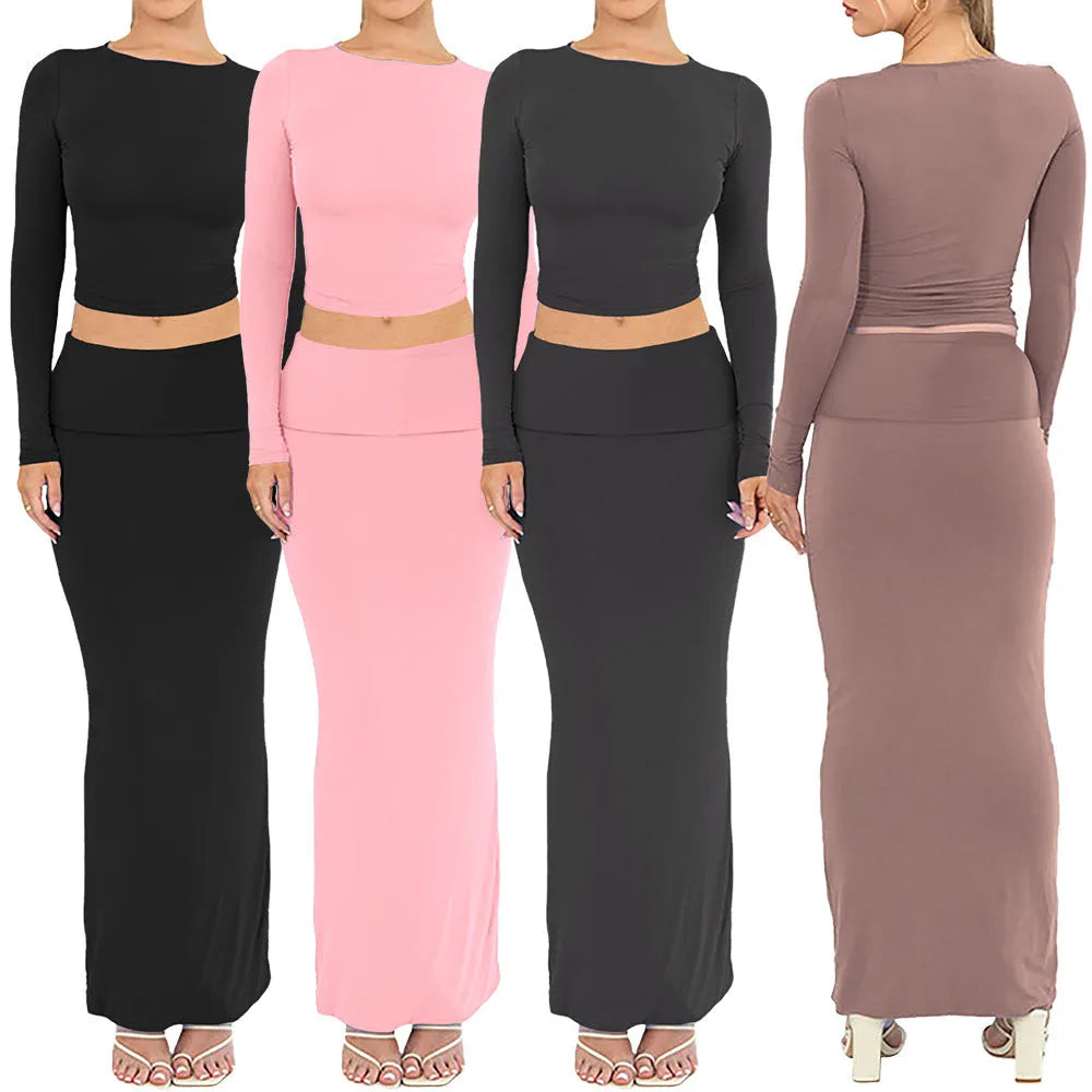 Women's black two-piece autumn suit featuring a crop top and long skirt in a slim fit.