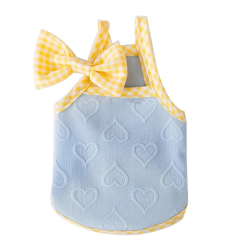Small dog wearing heart pattern bow suspenders vest with matching hairband in Bondi Blue colour