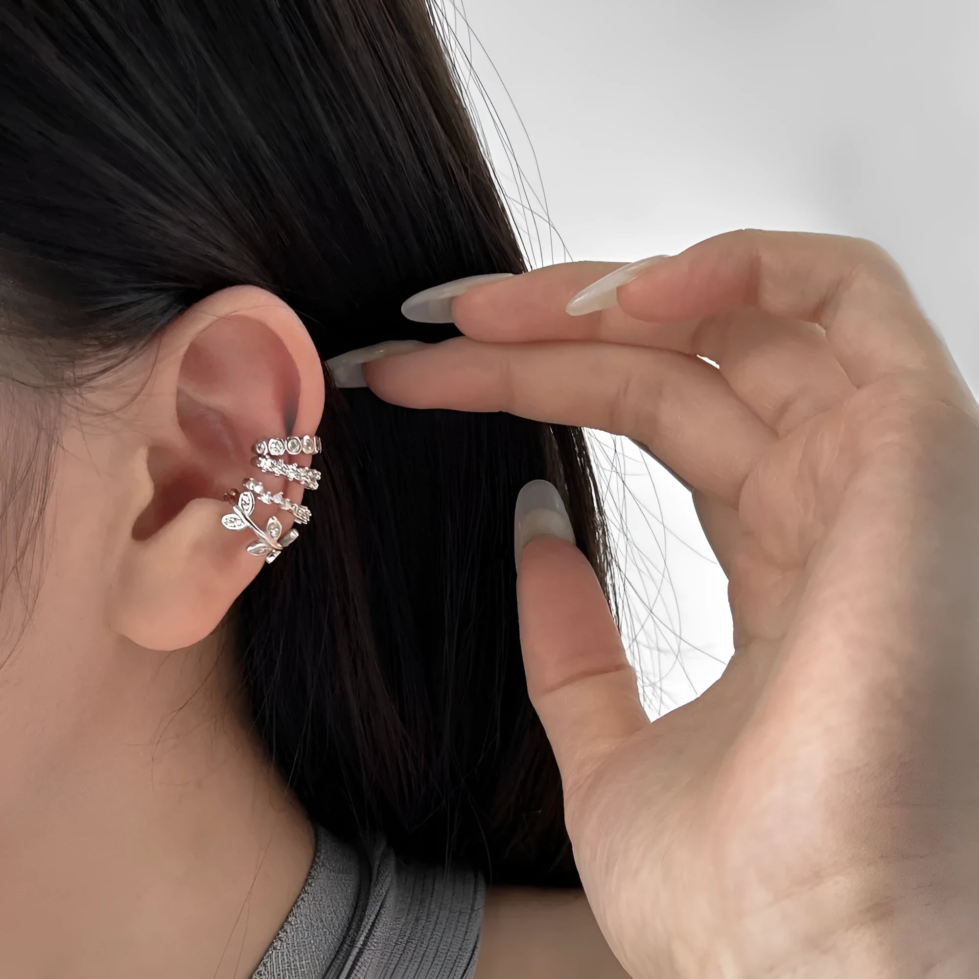Sterling silver ear clip with leaf shape and zircon inlay in gold electroplated finish for women