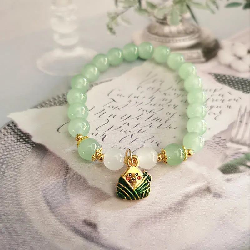 Chinese style bamboo leaf glass bracelet for women with a bamboo joint design.