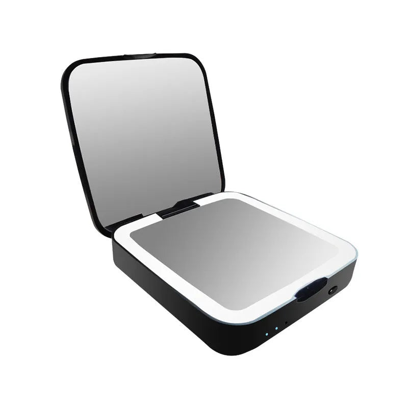 Black and white makeup mirror with LED lights around the edge, showing both the magnifying and standard mirror sides.