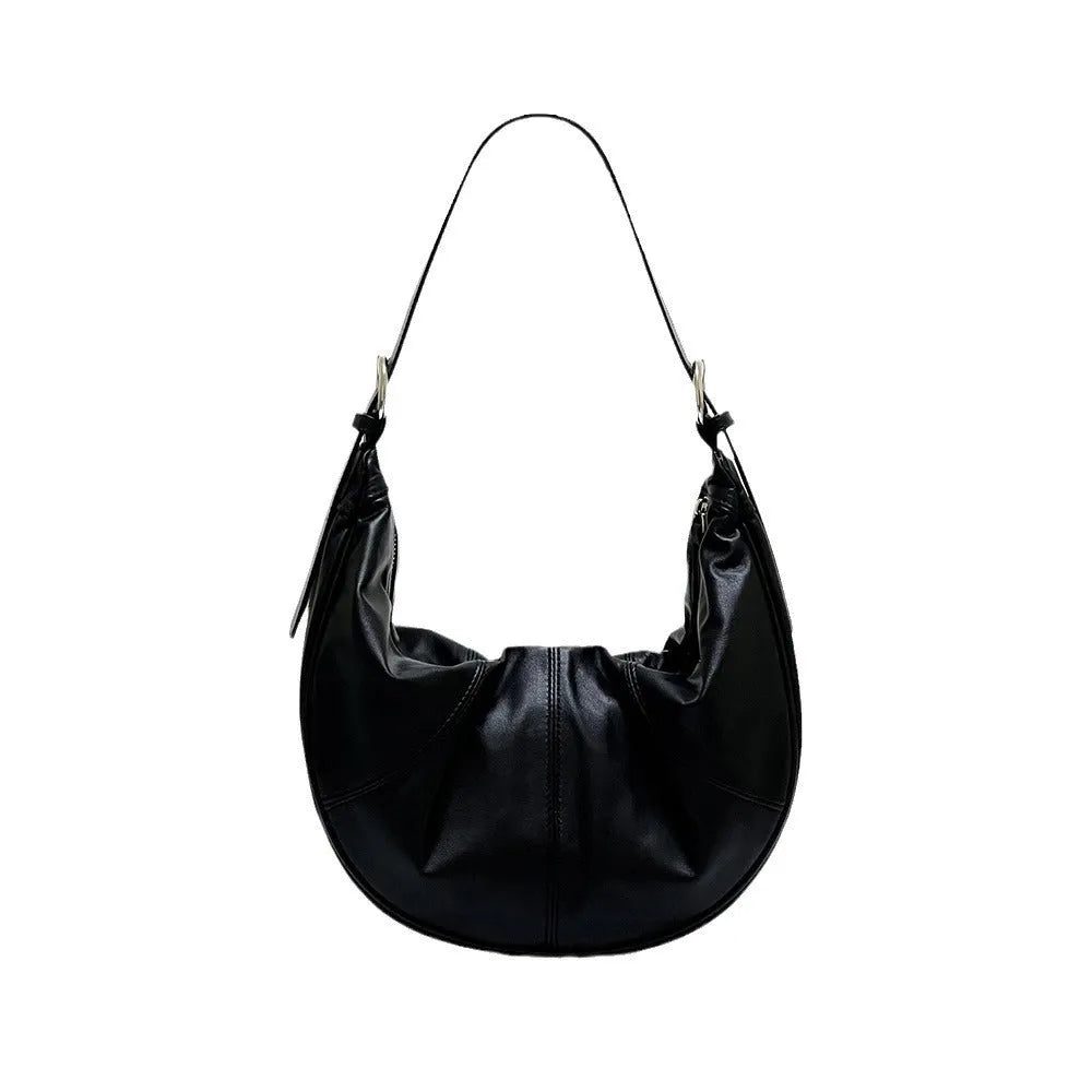 Women's soft cowhide leather shoulder bag with dumpling shape showing sandwich pocket and double joint straps