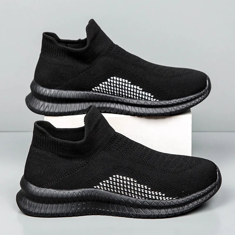 Popcorn Flyknit fabric low-top casual sneaker in white, black, or blue with a flat heel.