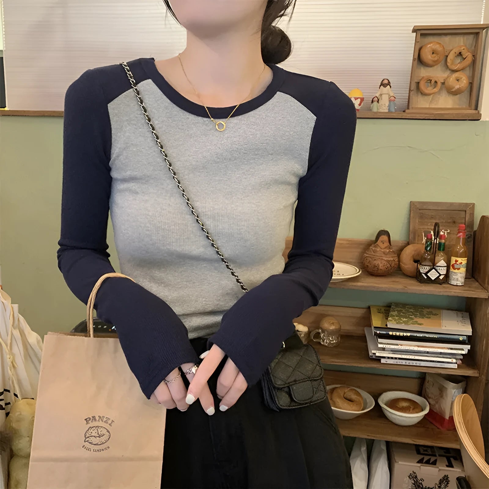 Women's dark blue viscose top with long polished princess sleeves and an oversized slim fit.
