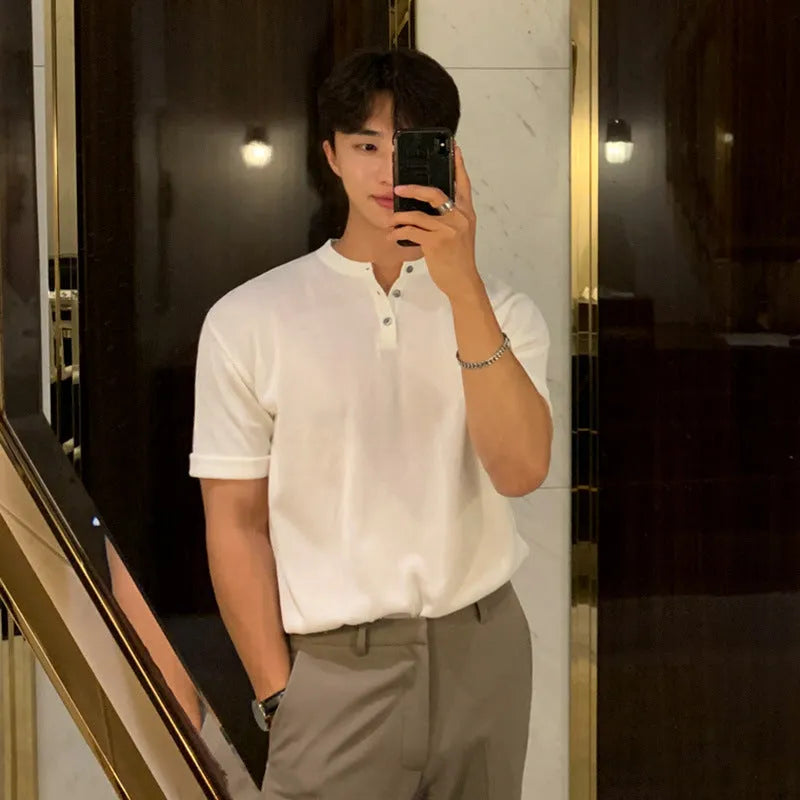 Man wearing a slim-fit black short-sleeved ice silk knitted shirt.